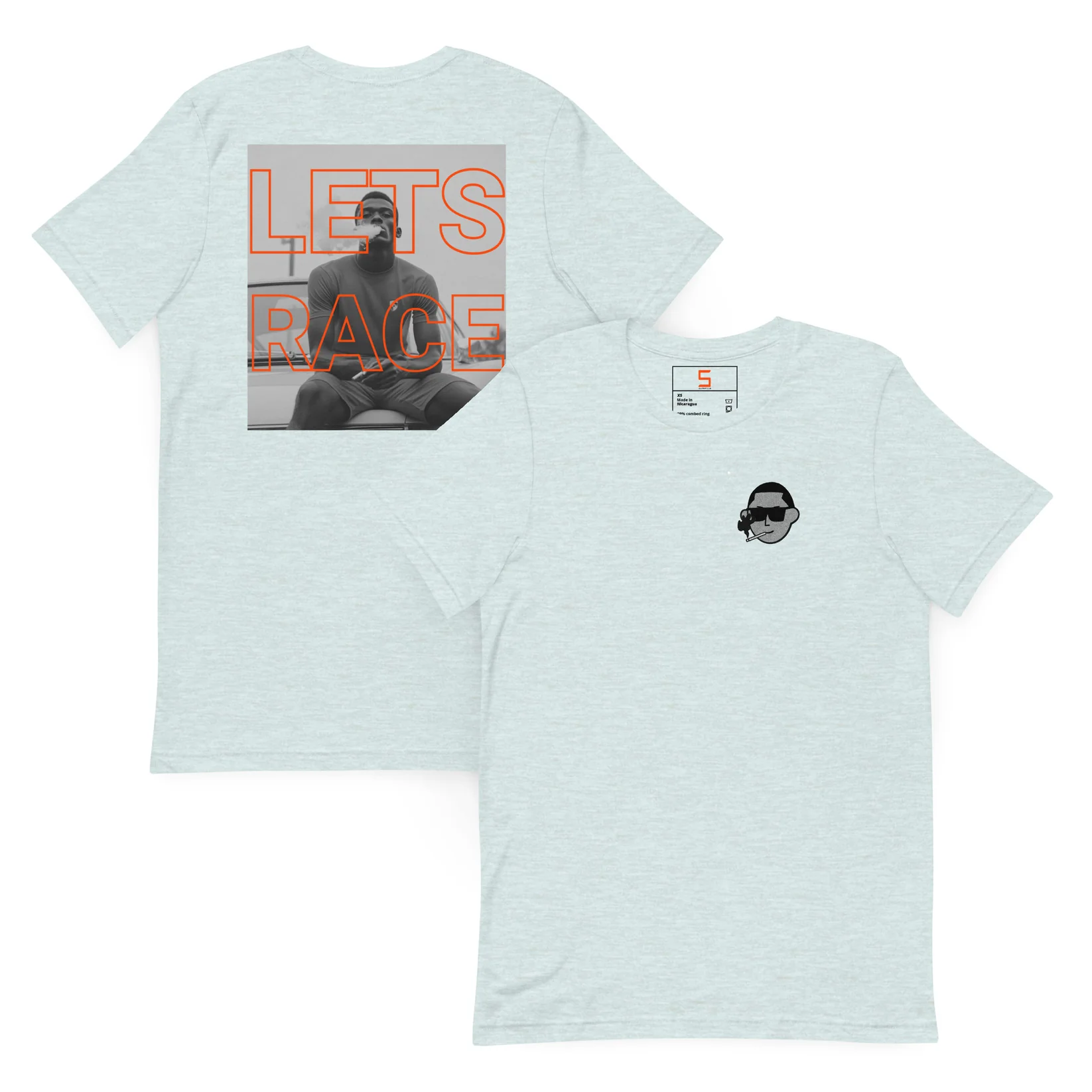 Light heathered blue T-shirt front and back; back shows black-and-white photo of seated man overlaid with large orange outlined text "LETS RACE", front left chest has small black cartoon face wearing sunglasses and smoking.